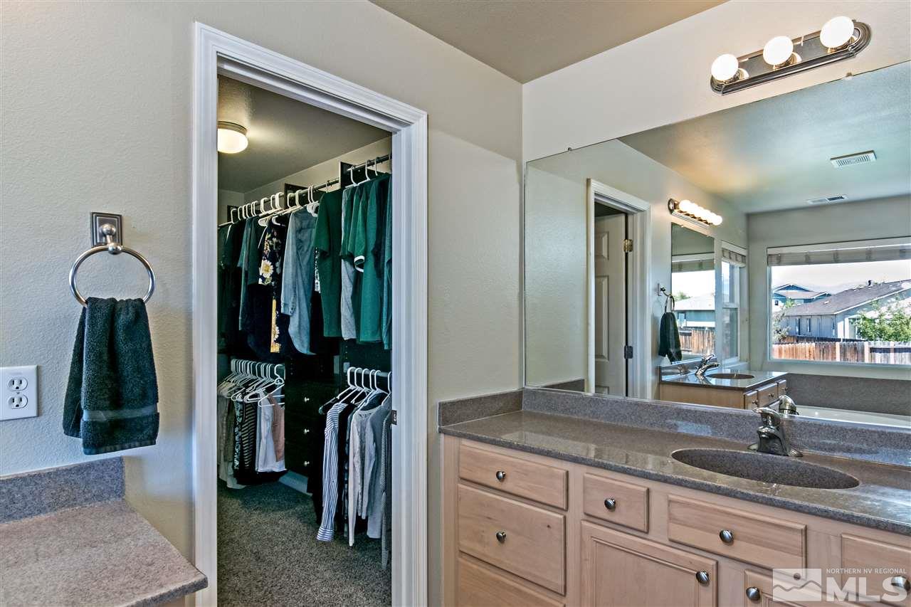 2330 Clementine Lane Reno, NV 89521 - Photo 18 of 32 a bathroom with sink and mirror