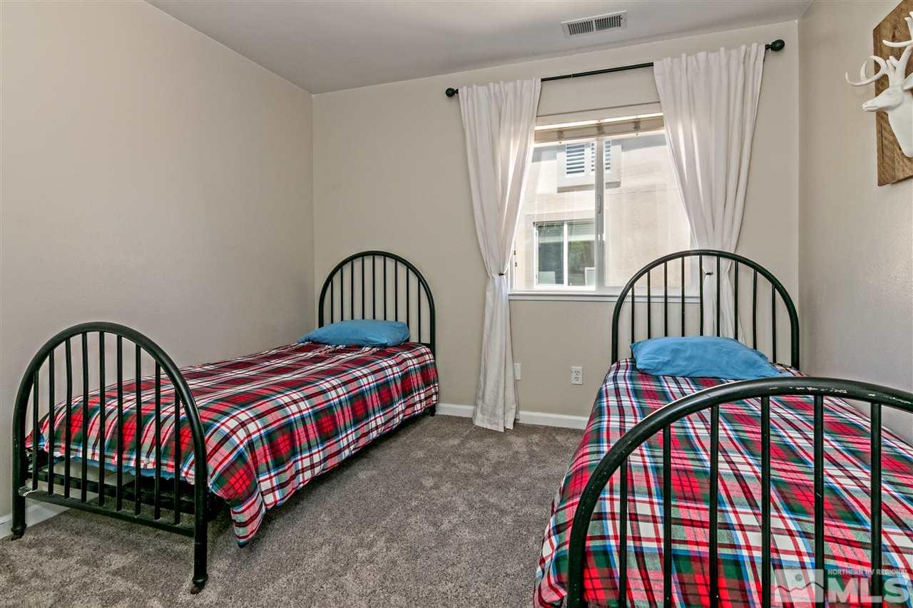 2330 Clementine Lane Reno, NV 89521 - Photo 23 of 32 a bedroom with a bed and a window