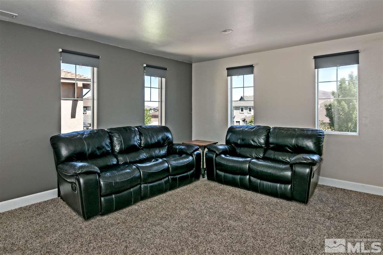 2330 Clementine Lane Reno, NV 89521 - Photo 24 of 32 a living room with furniture and windows
