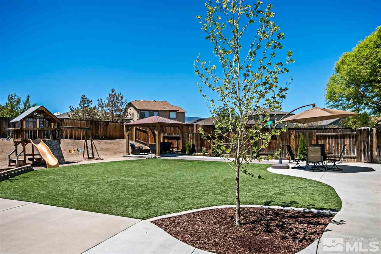 2330 Clementine Lane Reno, NV 89521 - Photo 27 of 32 a front view of a house with a yard
