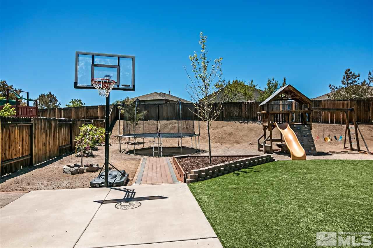 2330 Clementine Lane Reno, NV 89521 - Photo 28 of 32 a view of a house with backyard water fountain and sitting area