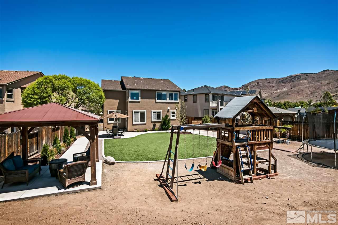 2330 Clementine Lane Reno, NV 89521 - Photo 29 of 32 a view of a patio with a table and chairs under an umbrella