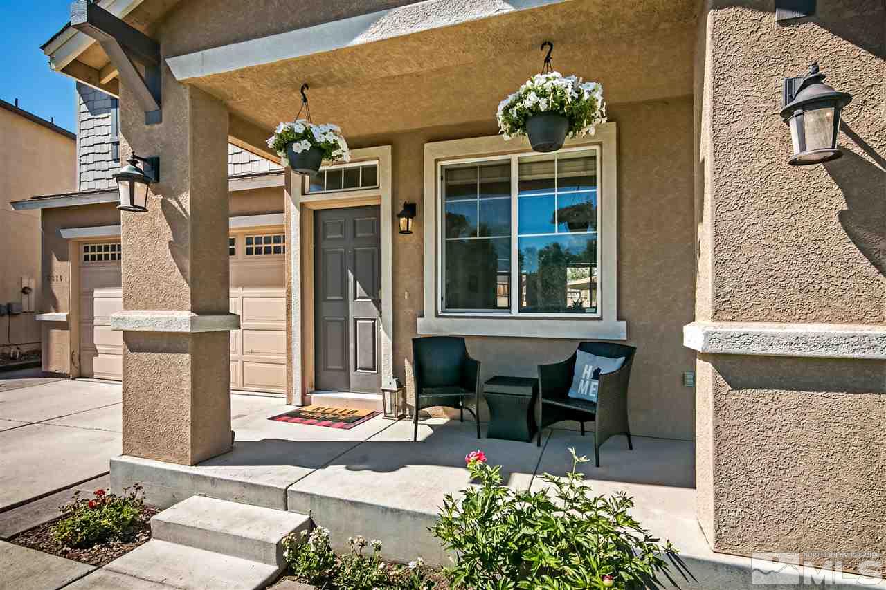 2330 Clementine Lane Reno, NV 89521 - Photo 3 of 32 a front view of a house with a garden