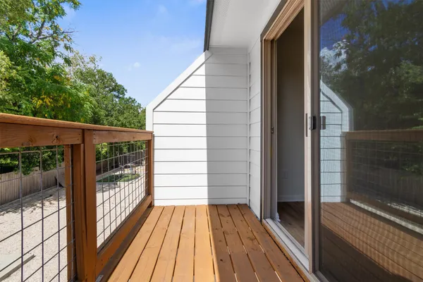 a view of balcony with wooden floor