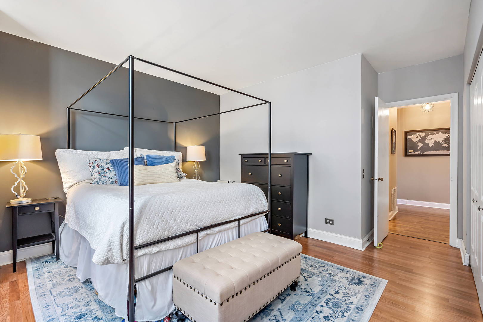780 South Federal Street, Unit 804 Chicago, IL 60605 - Photo 12 of 15 a bedroom with a bed and wooden floor