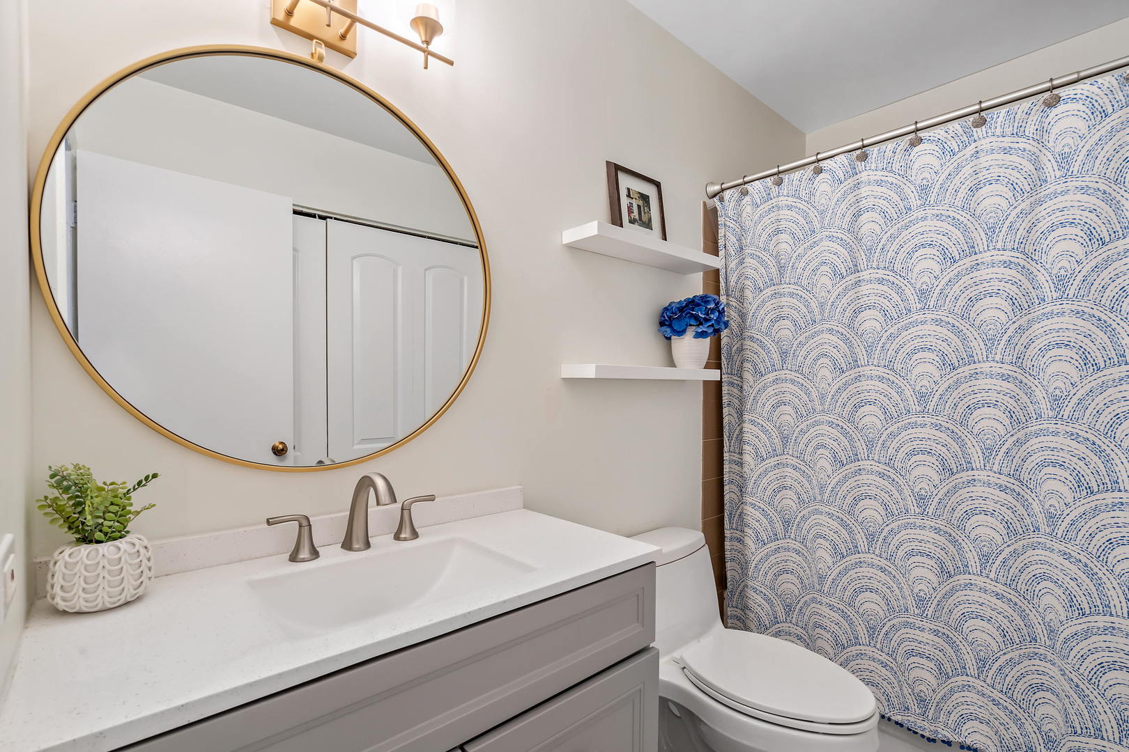 780 South Federal Street, Unit 804 Chicago, IL 60605 - Photo 13 of 15 a bathroom with a sink mirror vanity and toilet