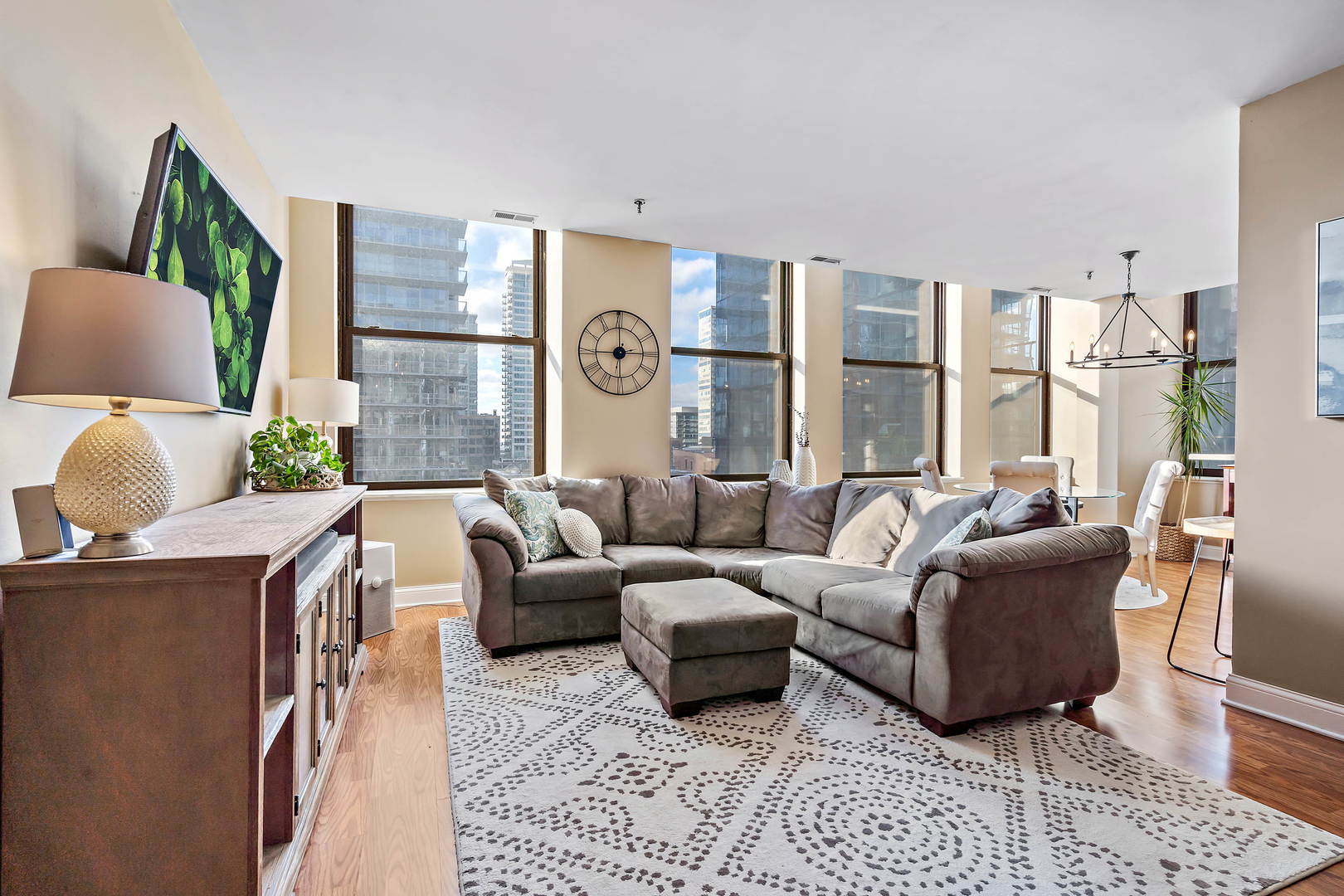 780 South Federal Street, Unit 804 Chicago, IL 60605 - Photo 2 of 15 a living room with furniture and a large window