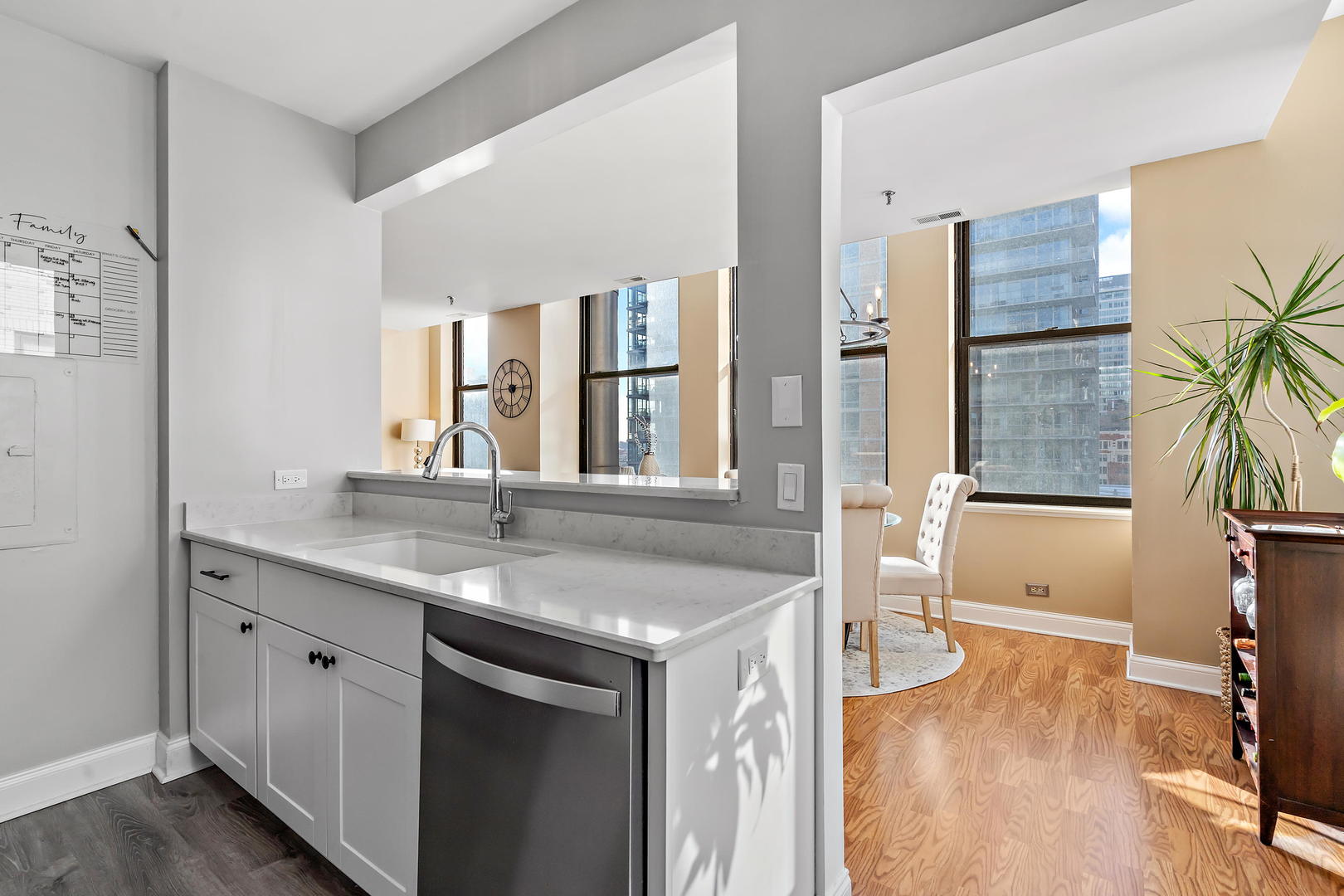 780 South Federal Street, Unit 804 Chicago, IL 60605 - Photo 4 of 15 a kitchen with a sink cabinets and wooden floor