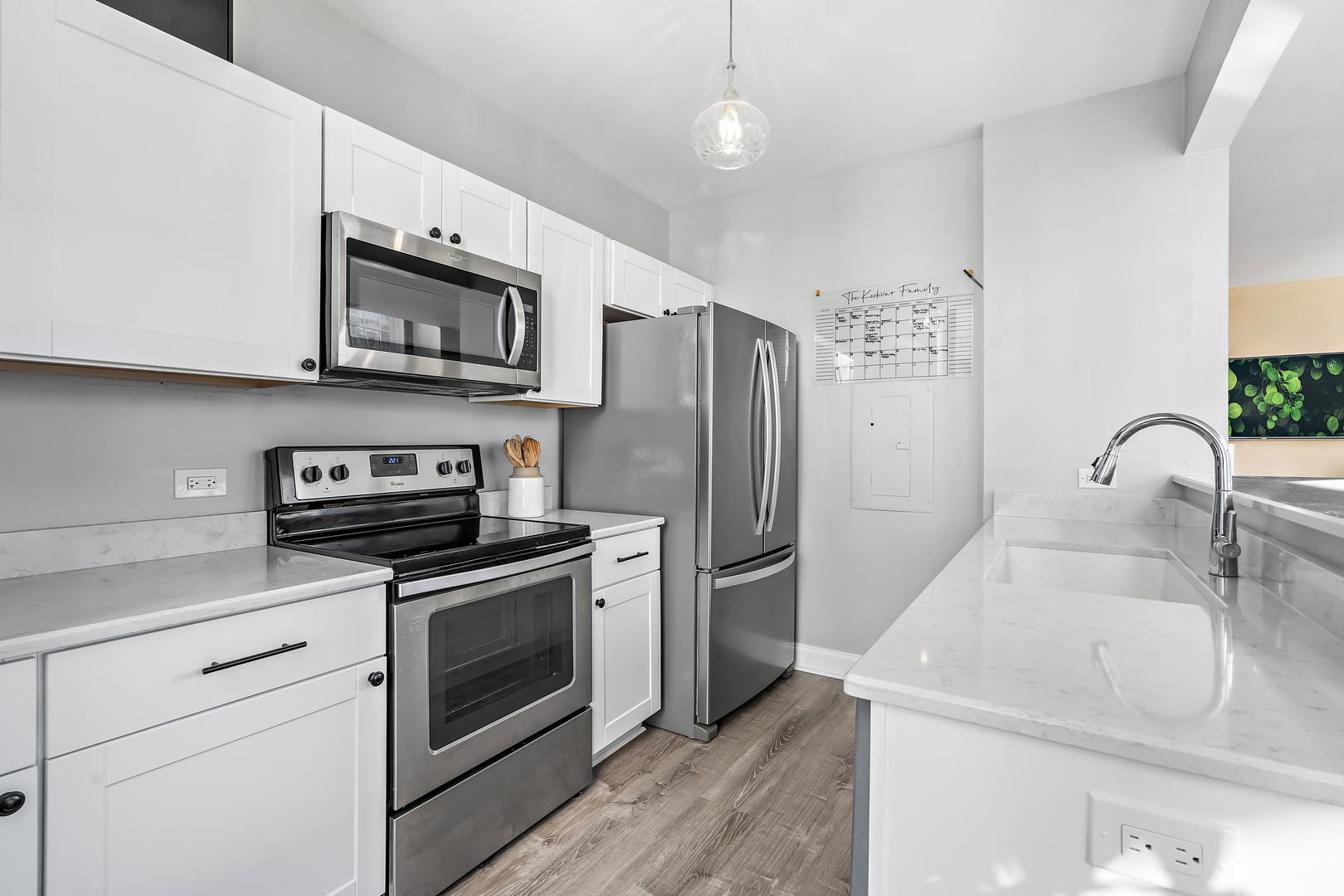 780 South Federal Street, Unit 804 Chicago, IL 60605 - Photo 5 of 15 a kitchen with stainless steel appliances a stove microwave and a refrigerator
