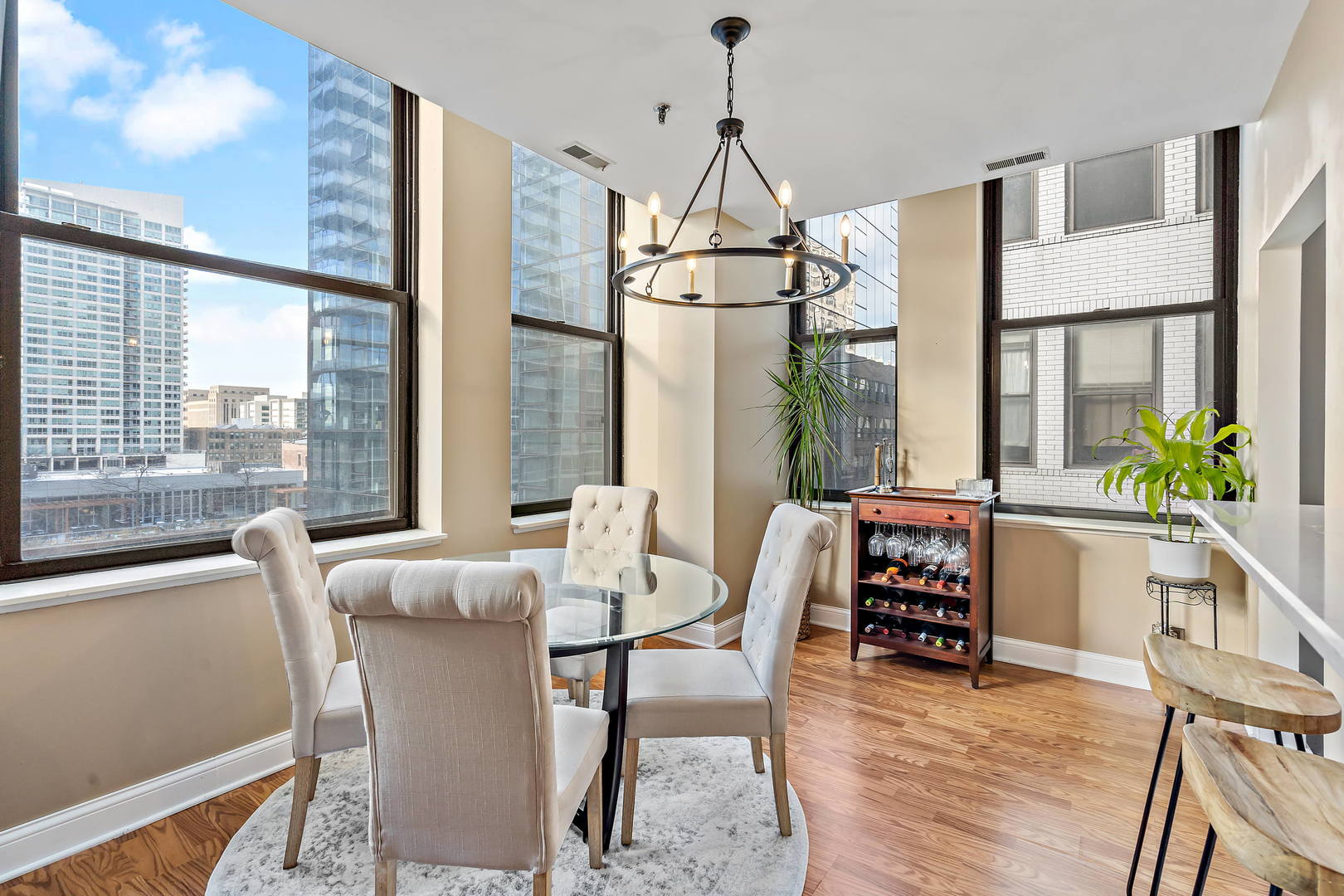 780 South Federal Street, Unit 804 Chicago, IL 60605 - Photo 10 of 15 a dining room with furniture a chandelier and wooden floor