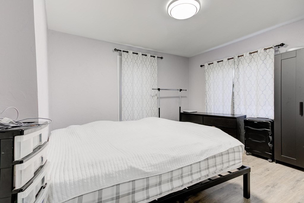 51 Prospect Street Woburn, MA 01801 - Photo 13 of 40 a bedroom with a bed and a dresser