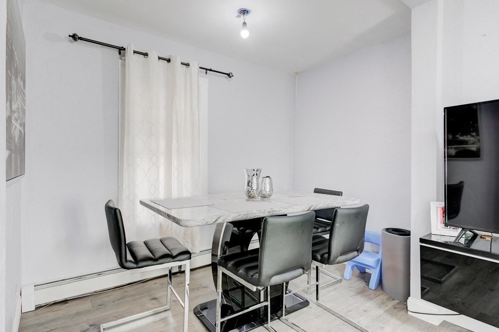 51 Prospect Street Woburn, MA 01801 - Photo 20 of 40 a view of a workspace with furniture and a window