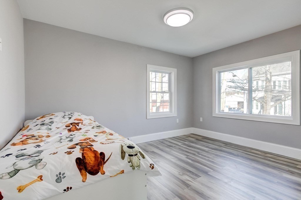 51 Prospect Street Woburn, MA 01801 - Photo 30 of 40 a bedroom with a bed and a window