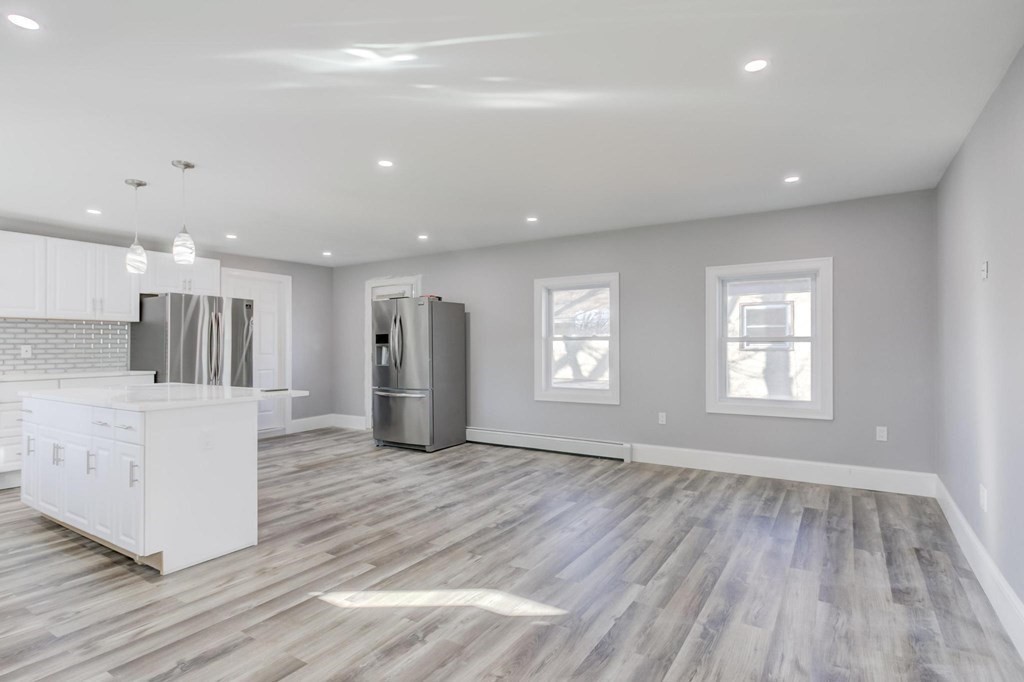 51 Prospect Street Woburn, MA 01801 - Photo 35 of 40 a view of kitchen with cabinets and wooden floor