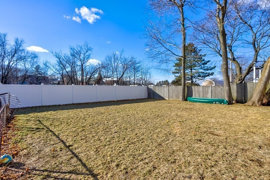 51 Prospect Street Woburn, MA 01801 - Photo 9 of 40 a view of an house with backyard and tree