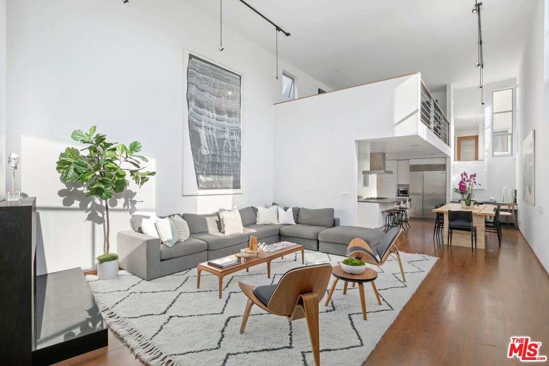 216 Grand Boulevard Venice, CA 90291 - Photo 1 of 30 a living room with furniture and wooden floor