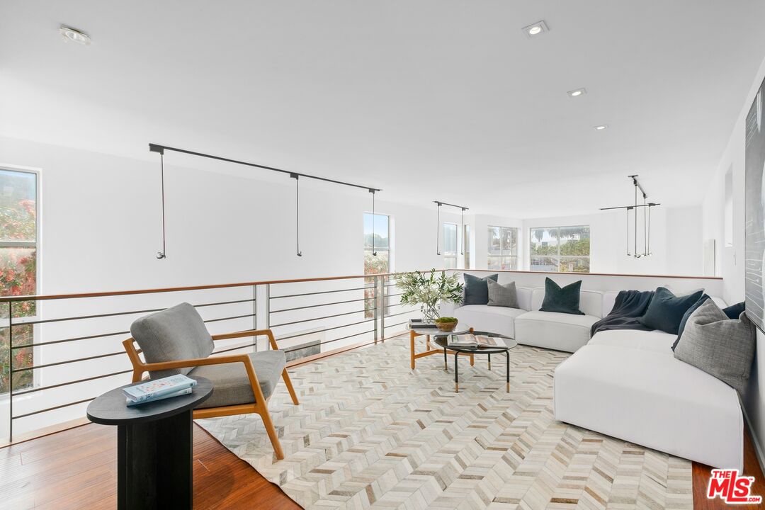 216 Grand Boulevard Venice, CA 90291 - Photo 11 of 30 a living room with furniture and a wooden floor