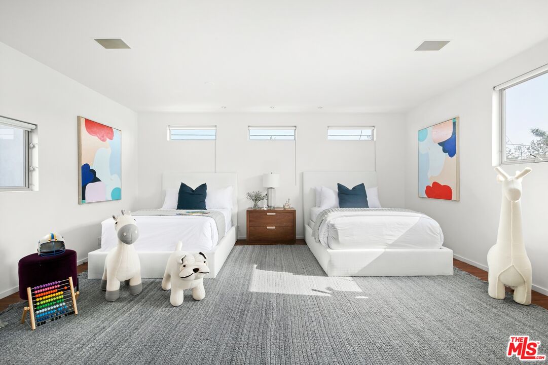 216 Grand Boulevard Venice, CA 90291 - Photo 17 of 30 a bed room with a bed and a couch