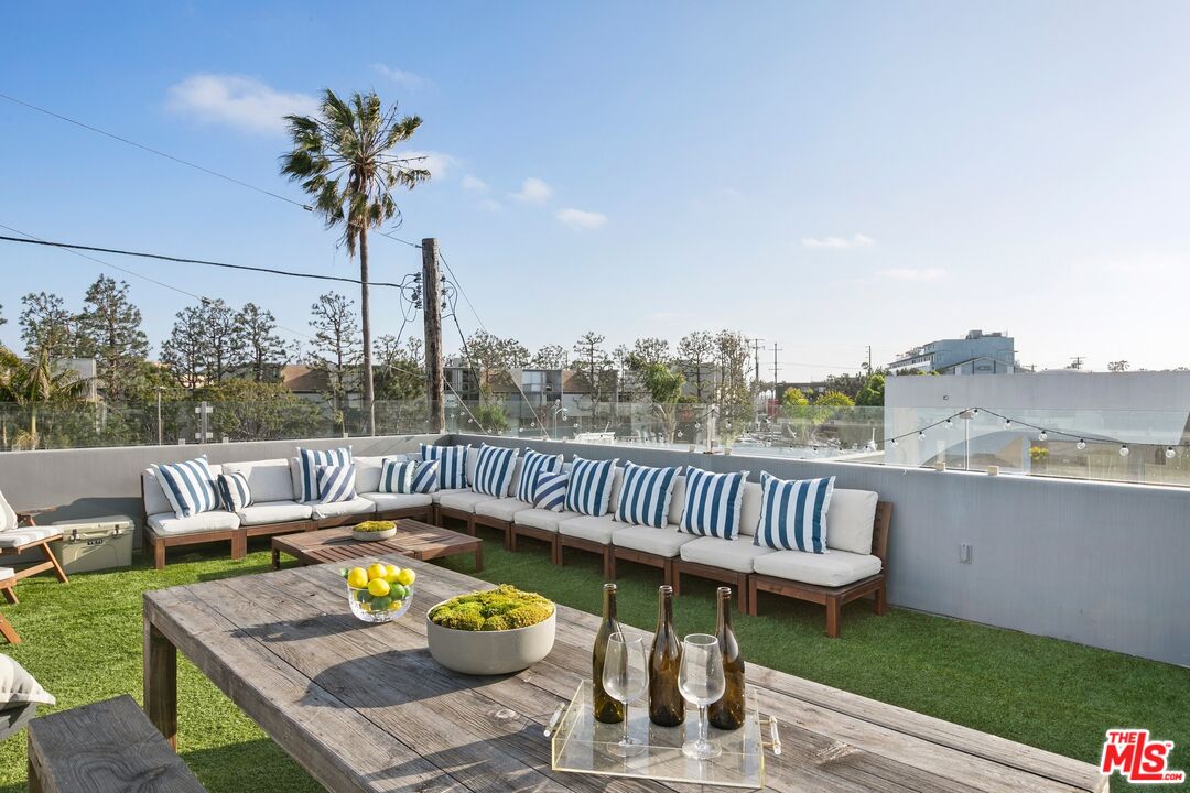 216 Grand Boulevard Venice, CA 90291 - Photo 23 of 30 a view of a patio with a table chairs and a potted plant