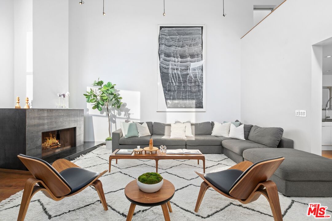 216 Grand Boulevard Venice, CA 90291 - Photo 4 of 30 a living room with furniture and a fireplace