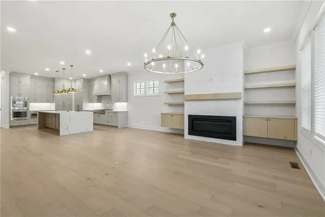 a view of a kitchen with a stove cabinets and a kitchen