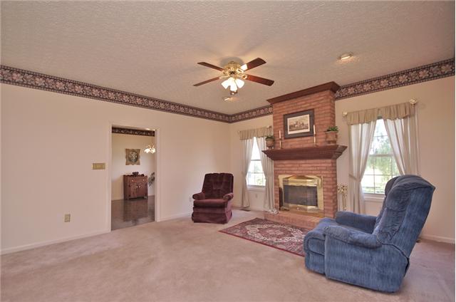 226 Lawrence Lane Springfield, TN 37172 - Photo 5 of 20 The Living/Great Room offers a Masonary Fireplace with Gas Logs and easy access to the Kitchen, Eat-In Area and the Formal Dining Room.