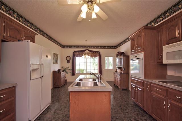 226 Lawrence Lane Springfield, TN 37172 - Photo 6 of 20 The Large Kitchen and Eat-In Area, the Door leads to the Covered Patio, great for outdoor entertaining.