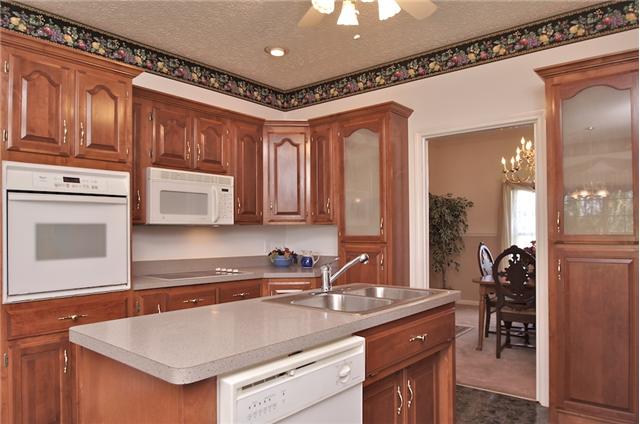 226 Lawrence Lane Springfield, TN 37172 - Photo 7 of 20 Custom Cherry Cabinets. Built-In Cooktop & Oven, Microwave, Dishwasher and Refrigerator all remain.