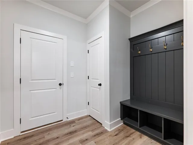 a view of kitchen with wooden floor and staircase