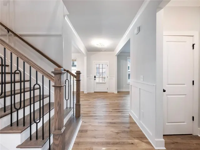 a kitchen with white cabinets and appliances