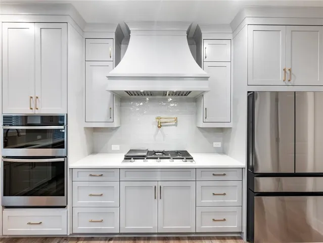a bathroom with a glass shower door