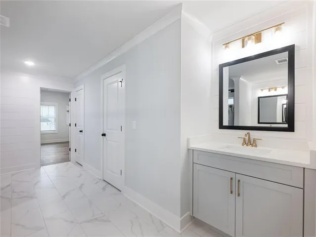 a bathroom with a sink and shower
