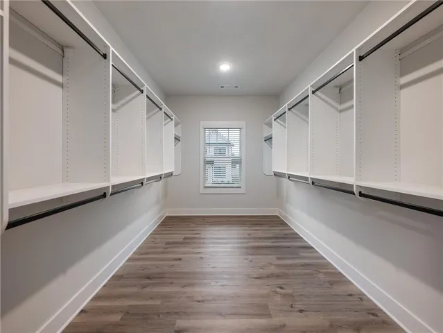 a kitchen with cabinets and white appliances