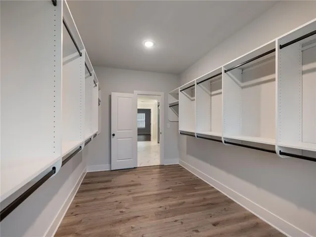 a view of wooden floor and windows in a room