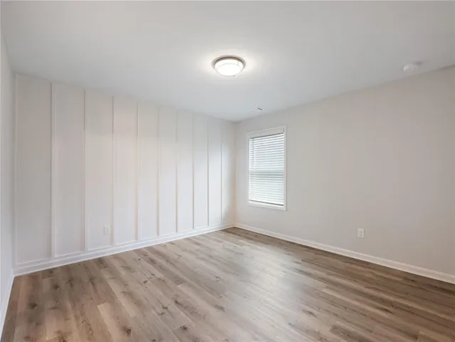 a bathroom with a bathtub sink vanity and a shower