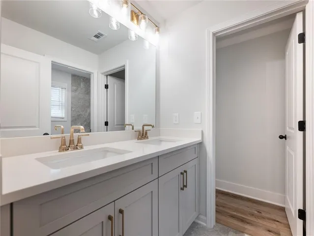 a view of room with wooden floor