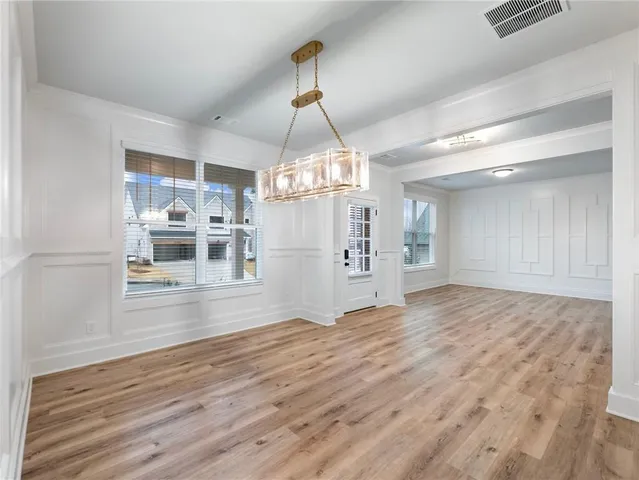 a view of a living room and kitchen with granite countertop cabinets