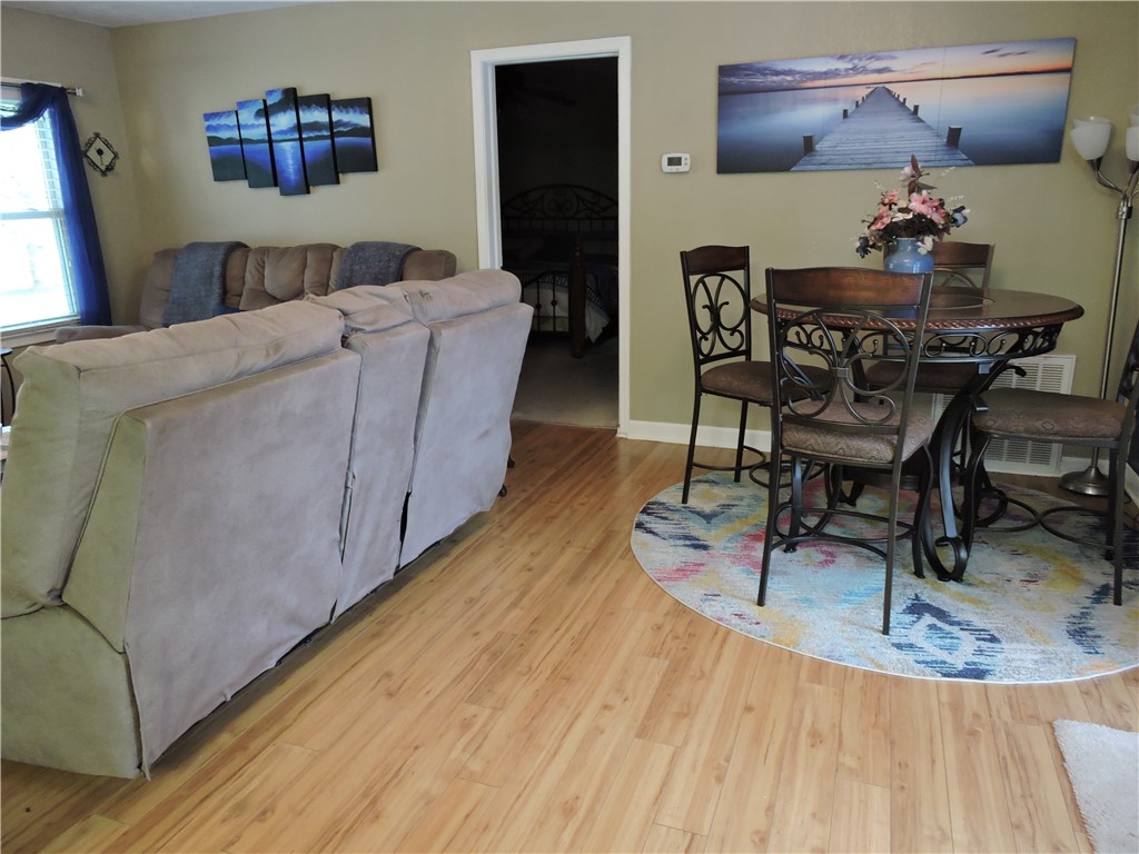 1901 Hattons Ford Road Townville, SC 29689 - Photo 10 of 33 Hardwood-style flooring extends through the open concept living and dining spaces.