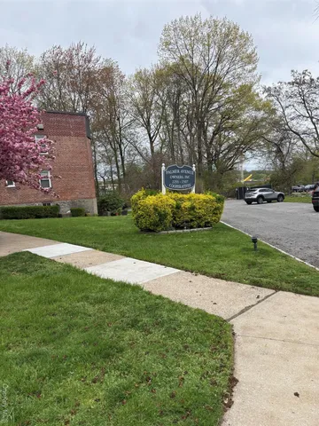 a view of a back yard with potted plants