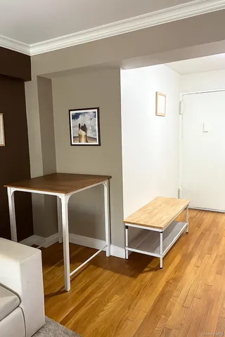 a living room with a balcony and a couch