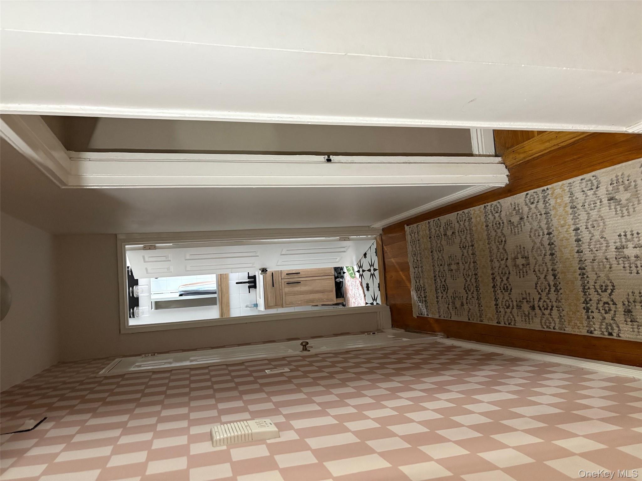 2295 Palmer Avenue, Unit 1N New Rochelle, NY 10801 - Photo 5 of 16 a view of a hallway with wooden floor and a bathroom