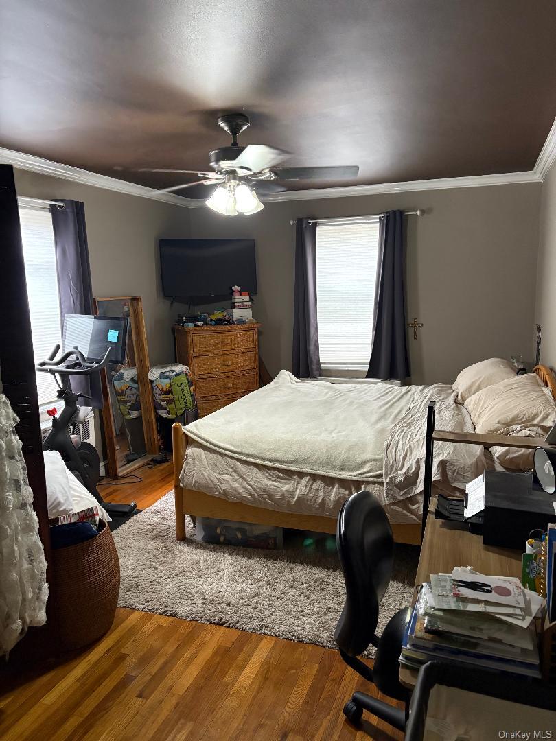 2295 Palmer Avenue, Unit 1N New Rochelle, NY 10801 - Photo 9 of 16 a bedroom with a bed and wooden floor