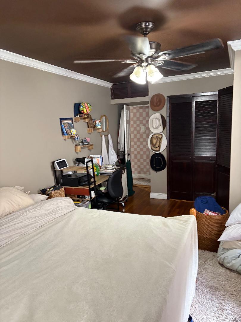 2295 Palmer Avenue, Unit 1N New Rochelle, NY 10801 - Photo 10 of 16 a bedroom with bed and a chandelier