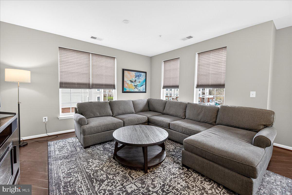 3911 Doc Berlin Drive, Unit 37 Silver Spring, MD 20906 - Photo 16 of 35 a living room with furniture and a window