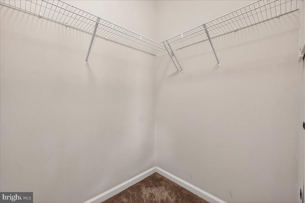 3911 Doc Berlin Drive, Unit 37 Silver Spring, MD 20906 - Photo 23 of 35 a view of a room with racks on the wall