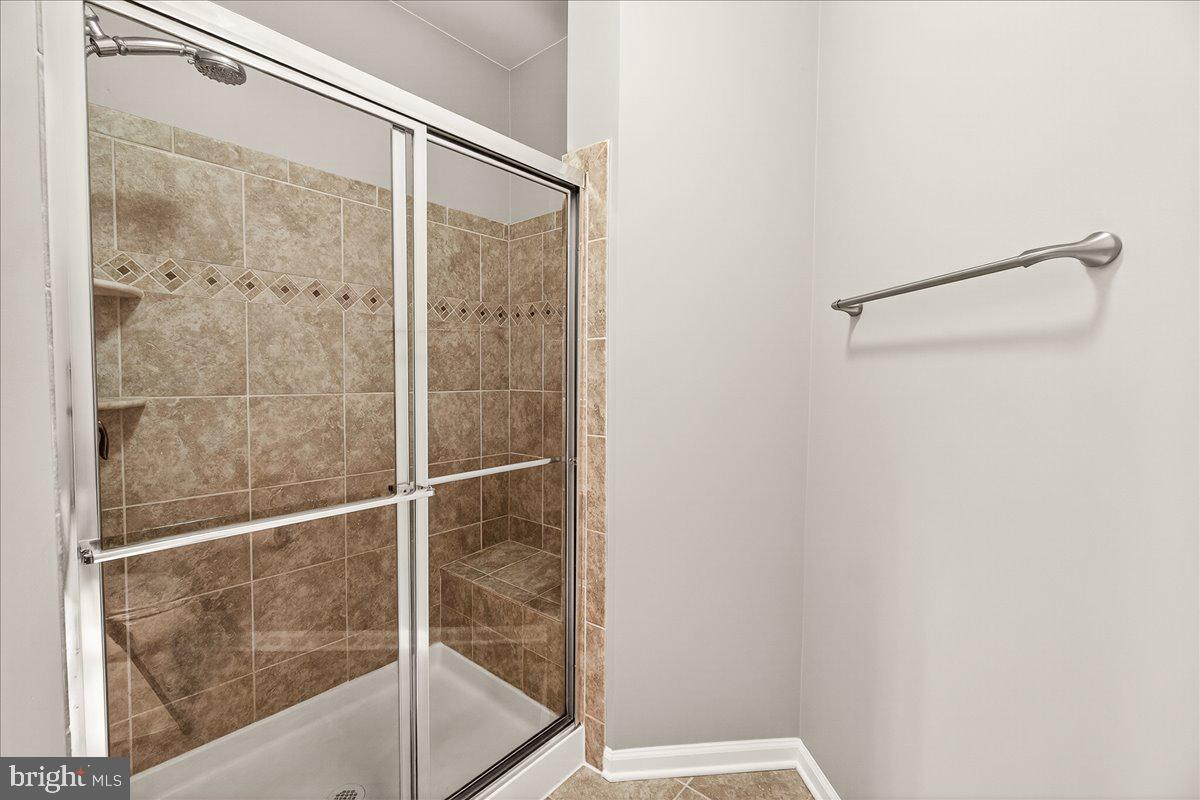 3911 Doc Berlin Drive, Unit 37 Silver Spring, MD 20906 - Photo 24 of 35 a bathroom with a glass shower door