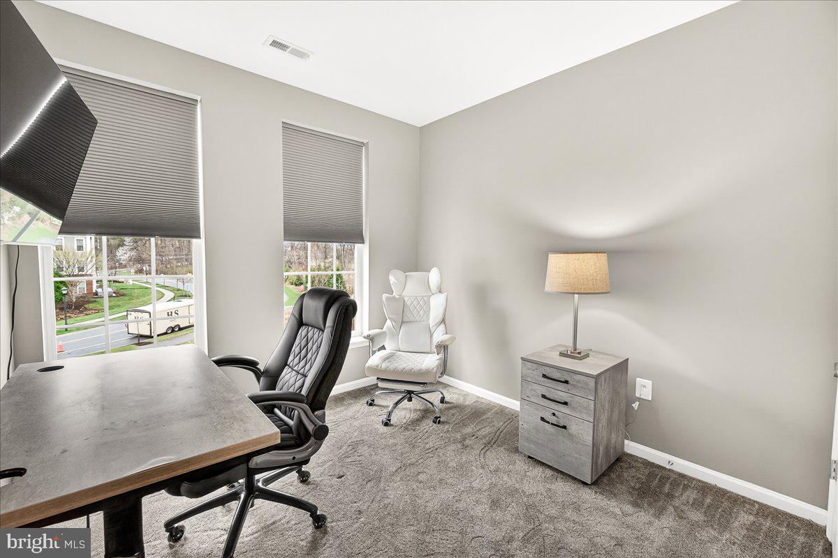 3911 Doc Berlin Drive, Unit 37 Silver Spring, MD 20906 - Photo 27 of 35 a view of a workspace with furniture and a window