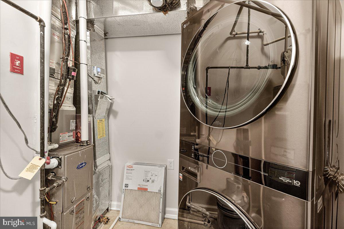 3911 Doc Berlin Drive, Unit 37 Silver Spring, MD 20906 - Photo 29 of 35 a utility room with a washer and dryer