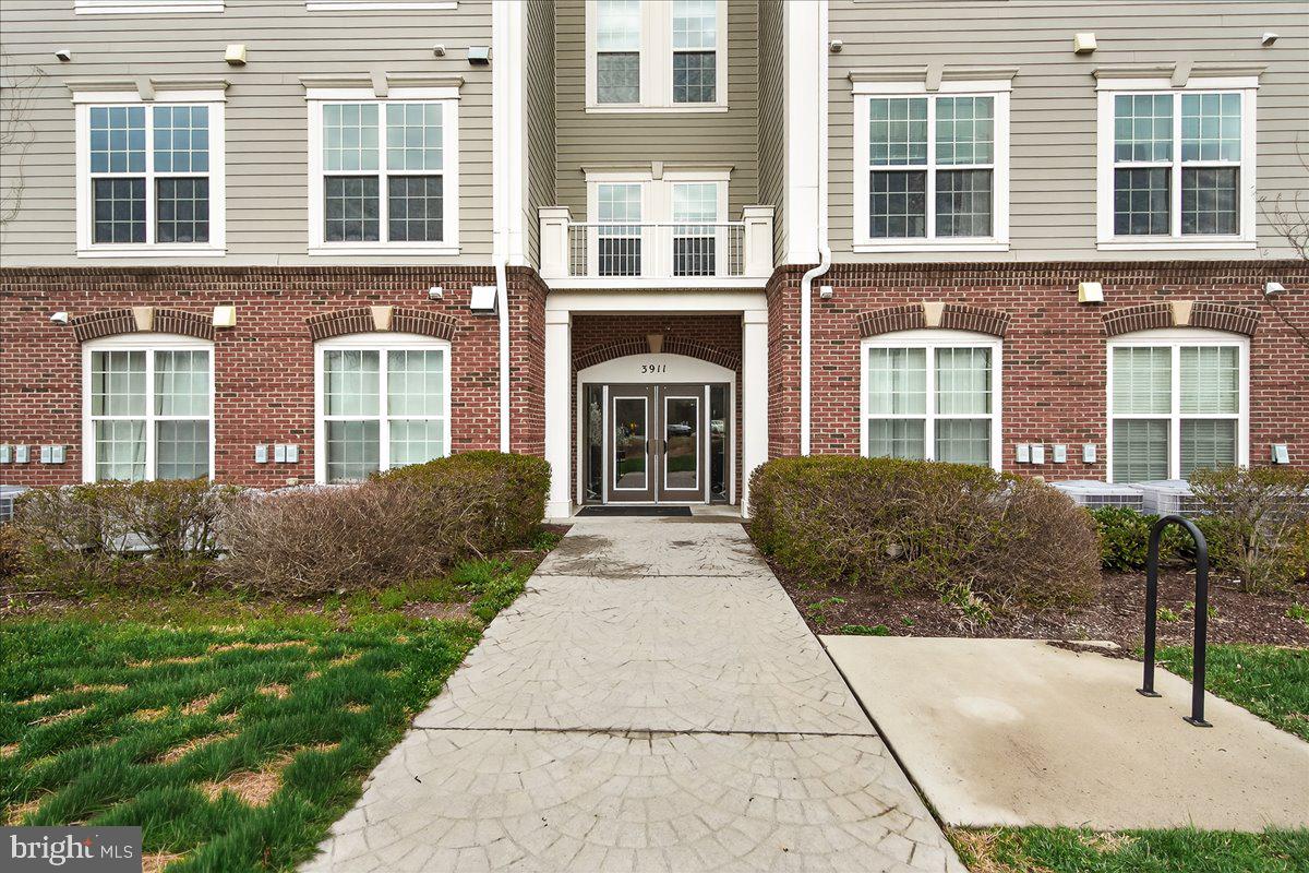 3911 Doc Berlin Drive, Unit 37 Silver Spring, MD 20906 - Photo 3 of 35 a front view of a house with garden