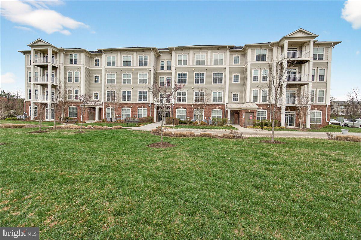 3911 Doc Berlin Drive, Unit 37 Silver Spring, MD 20906 - Photo 32 of 35 front view of a building with a yard
